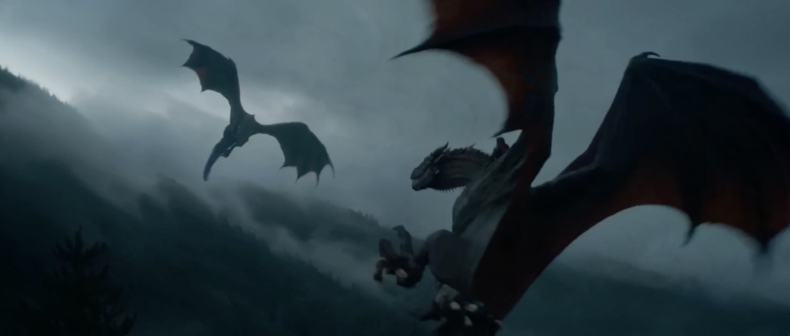 Fantasy example still: a dragon and its rider over misty mountains